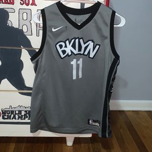 Men’s Large Gray Kyrie Irving Jersey- small burn hole, could be sewed